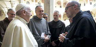 Pope Francis talks with leaders of Franciscan orders at the Basilica of St. Francis in Assisi, Italy, Oct. 3, 2020. The pope celebrated Mass and signed his new encyclical, "Fratelli Tutti, on Fraternity and Social Friendship," at the tomb of St. Francis in the basilica. (CNS photo/Vatican Media)
