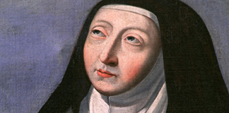 St. Teresa of Avila, mystic, founder of the Discalced Carmelites, and the first female declared a doctor of the church, is depicted in a church in Troyes, France. St. Teresa was born in Spain in 1515 and is the patron saint of the country. March 28 is the 500th anniversary of her birth. (CNS/Crosiers)