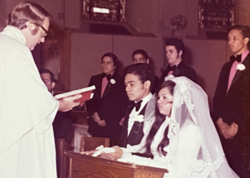 Then-Father Dennis Sullivan blesses a couple in marriage during his assignment at Saint Elizabeth Parish in the Washington Heights section of New York City. (Courtesy photo)