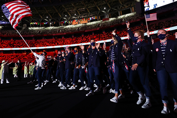 United States flag bearers Sue Bird and Eddy Alvarez lead their contingent in the parade of athletes during the opening ceremony of the Tokyo Summer Olympics July 23, 2021. (CNS photo/Stefan Wermuth, Reuters)