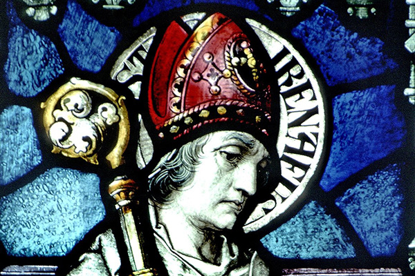 The likeness of St. Irenaeus of Lyon is pictured in a stained-glass window at the Basilica of Our Lady Immaculate in Guelph, Ontario. During an Oct. 7, 2021, meeting with members of the St. Irenaeus Joint Orthodox-Catholic Working Group, Pope Francis said he will soon declare St. Irenaeus a doctor of the church. (CNS photo/The Crosiers)