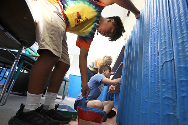 Teenagers volunteer their time painting classrooms at Our Lady Star of the Sea Regional School in Atlantic City during the annual Summer in the City immersion experience, Friday, Aug. 18, 2023. (Lori M. Nichols for Catholic Star Herald)