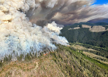 An aerial view shows plumes of smoke rising over burning vegetation during a wildfire in Battleship Mountain, British Columbia, Sept. 10, 2022. There are 193 active wildfires currently burning in British Columbia, including the Flood Falls fire in the south of the province and Battleship Mountain blaze in the northeast. About 1,000 people have been forced to leave their homes. (CNS photo/BC Wildfire Service via Reuters)