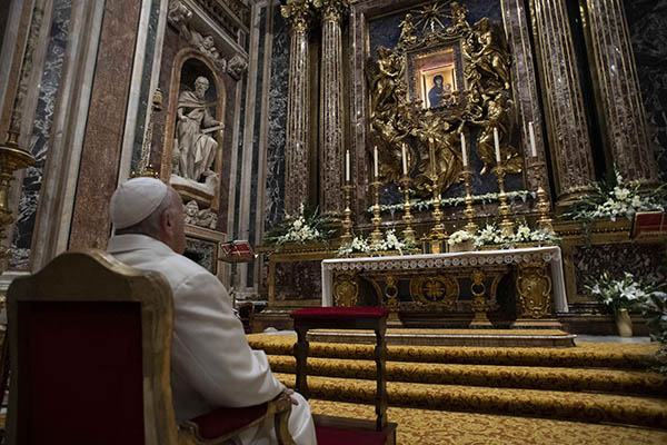 Pope Francis prays in front of the Marian icon "Salus Populi Romani" at the Basilica of St. Mary Major in Rome Dec. 8, 2021, the feast of the Immaculate Conception. (CNS photo/Vatican Media)