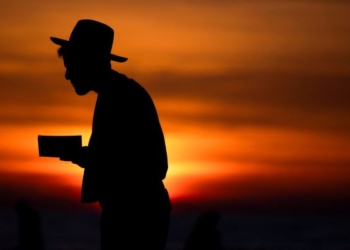 A man prays during sunset, amid the ongoing conflict between Israel and the Palestinian group Hamas, in Ashkelon, Israel, Jan. 8, 2024. (OSV News photo/Amir Cohen, Reuters)