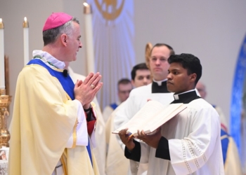 Seminarian Theodore Deluhery participates in Ordination Mass, May 17, in Our Lady of Lourdes Church, Glassboro. (Photo - Joe Warner)