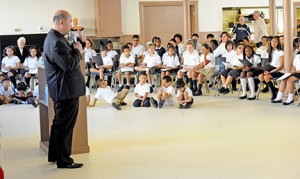 Father Joseph Pham, pastor of Our Lady Star of the Sea Parish, Atlantic City, speaks to children of the parish school. A number of students, who had planned to leave the school in the wake of the casino closings, have been able to stay with the aid of a tuition assistance fund. Photo by Alan M. Dumoff,  ccdphotolibrary.smugmug.com 