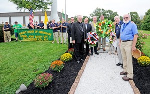 Bishop Dennis Sullivan joined Irish-Catholic men on Sept. 13 and took part in the Ancient Order of Hibernians’ wreath-laying ceremony at the Barry Monument at the Commodore Barry Bridge in Bridgeport, Gloucester County. Above, Bishop Sullivan with members and dignitaries, including Father Ken Hallahan, spiritual director of the Ancient Order of Hibernians’ Gloucester County chapter; and Father Michael Romano, priest secretary. The mission of the Ancient Order of Hibernians is “to promote friendship, unity and Christian charity.” Commodore Barry, who served in the American Revolutionary War, is sometimes referred to as the Father of the American Navy. Photo by Alan M. Dumoff 