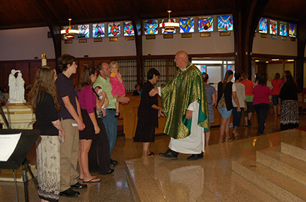 Photo by James A. McBride

Father Joseph Ganiel, pastor, greets catechists at Holy Child Parish in Runnemede on Sept. 7, its observance of Catechetical Sunday.