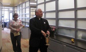 Father Tim Judge, chaplain, blessing Holy Redeemer’s new offices in Runnemede.