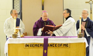 Bishop Dennis Sullivan celebrates Mass Dec. 18 in the Federal Correctional Institution (FCI) at Fairton, a medium security federal prison. Also pictured are, from left, Deacon Russell Davis of the Parish of All Saints in Millville; Deacon Michael Carter; and Father Vincent Guest, pastor of Holy Cross Parish, Bridgeton.  Photo by Alan M. Dumoff 
