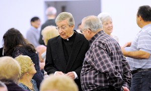 Msgr. Thomas Morgan speaks to people at a covered dish dinner for participants in small Christian communities, held Nov. 6 at St. Mary Church, Cherry Hill. A retired pastor, Msgr. Morgan has for years promoted small Christian communities as a way to revitalize parishes and promote individual spiritual growth. Photo by Alan M. Dumoff, more photos ccdphotolibrary.smugmug.com 