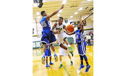 On Jan. 22, the home team Camden Catholic Irish beat the visiting Paul VI Eagles, 68-52, in Cherry Hill, in high school boys’ basketball. Above, a Camden Catholic player drives to the basket between two defenders.

Photo by Alan M. Dumoff, more photos http://ccdphotolibrary.smugmug.com