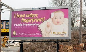 A pro-life billboard on Route 130 South at the Brooklawn Circle has a picture of an infant and the message, “I have unique fingerprints nine weeks from conception.” Photo by James A. McBride 