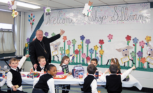 Bishop Dennis Sullivan and students gesture toward a sign they made welcoming him to Good Shepherd School, Collingswood, on Jan. 26. The bishop planned several school visits during Catholic Schools Week, celebrated nationally Jan. 25-31.

Photo by James A. McBride