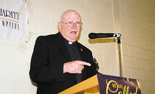 Jesuit Father William J. Byron encourages House of Charity volunteers at their campaign launch Jan. 13 at St. Isidore Parish in Vineland.

Photo by James A. McBride