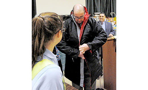 Pastor Rob Weinstein of Bridgeton tries on a donated coat.

Photo by Alan M. Dumoff