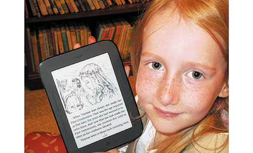 Monica Pagano holds a tablet with a story about St. Therese that she is reading. Her father Paul is the founder of Catholic Children’s E-Books, a website where parents can find and purchase exclusively Catholic reading material for their pre-K to college-age children.