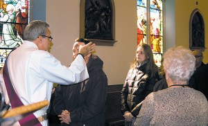 Deacon Gerard Jablonowski distributes ashes at the Cathedral of the Immaculate Conception, Camden.  Photo above by James A. McBride  Students receive ashes at St. Augustine Preparatory School, Richland, on Ash Wednesday. Deacon John Kacy giving ashes to fourth grader Kaitlyn Budniak of St. Mary School, Williamstown. 