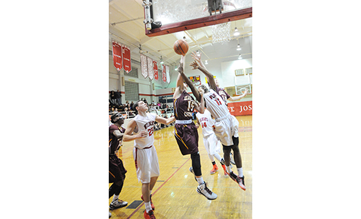On Feb. 5, St. Joseph (Hammonton) defeated visiting Gloucester Catholic, 65-58, in an overtime high school boys basketball thriller. Two days later, St. Joseph lost to St. Augustine Prep, 62-48, in Richland. Above photo: Gloucester Catholic’s Austin Regan goes up for the ball amidst St. Joseph defenders. Below, a Wildcat dunks one in.

Photos by Alan M. Dummoff, more photos , http://ccdphotolibrary.smugmug.com