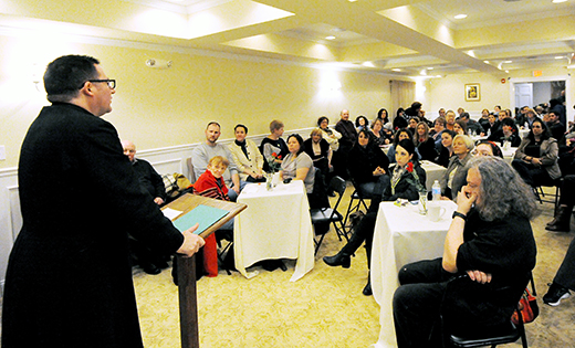 A large crowd turned out to hear Father Joseph Szolack, pastor of Infant Jesus Parish in Woodbury Heights, discuss the devil and exorcism at  the Collegium Center for Faith and Culture, Haddon Heights, on Feb. 13.

Photo by Alan M. Dumoff