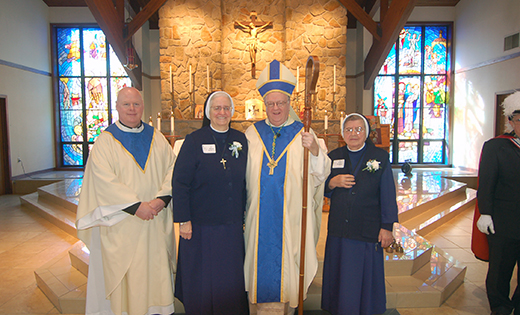 Bishop Sullivan and Father Hughes with those celebrating 60 years: Sister Philomena Nowicka, LSIC, and Sister Aurelia Jackiewicz, LSIC.

Photo by James A. McBride