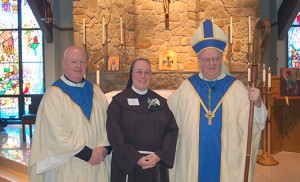 Bishop Sullivan and Father Hughes with Sister Dianna Higgins, FMIJ, celebrating 25 years. Not pictured in photos: Sister Rose Chuckerel, MPF (60), and Sister Roberta Patterson, SCC (70). Photo by James A. McBride