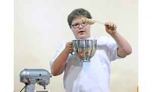 Seventh grader Andrew Zappley gives a cooking demonstration on herb butter Feb. 24 at Holy Trinity Regional School, before the MasterChef Jr. finale.  Samples of his creation, on crostini, were available for his audience. Photo by Alan M. Dumoff, more photos http://ccdphotolibrary.smugmug.com  