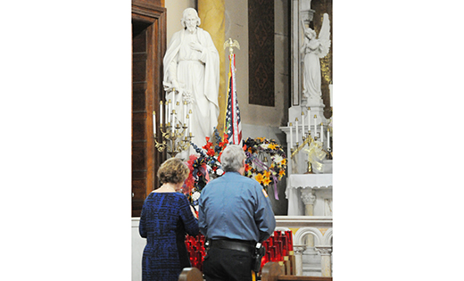 Laura and Nick Petrone of Egg Harbor Township pray before the start of the 30th annual memorial Mass honoring public safety personnel who have died in the line of duty. Msgr. William A. Hodge, pastor, celebrated the Mass March 15 at St. Nicholas of Tolentine Church, Atlantic City.

Photo by Alan M. Dumoff, more photos ccdphotolibrary.smugmug.com