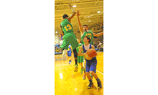 Photo by Alan M. Dumoff, 

http://ccdphotolibrary.smugmug.com
St. Rose of Lima, Haddon Heights, defeated St. Peter, Merchantville, 37-35 in the eighth grade basketball championship held March 17 at Paul VI High School, Haddon Township. Above, a Merchantville player prepares to take a shot against two Haddon Heights players.