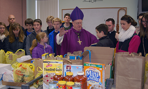 Bishop Dennis Sullivan blesses donated food brought to the Catholic Community of the Holy Spirit, Mullica Hill, on March 1 for the FaithFULL Food Drive. The donations were later loaded onto trucks and taken to a food bank for distribution. The diocesan-wide event made “a sizable impact” on bringing relief for the hungry in South Jersey, said Michael Jordan Laskey, director of Life and Justice for the Diocese of Camden.

Photo by James A. McBride