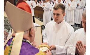 Joshua Nevitt, a seminarian of the Diocese of Camden currently in his second year of theology at the Pontifical North American College, Rome, recently received the ministry of acolyte from Bishop Paul Loverde of Arlington, Va.  He is pictured below with Bishop Loverde and Msgr. James Checchio, a priest of the Camden Diocese who is rector of North American College. Nevitt’s home parish is Our Lady of Peace in Williamstown.