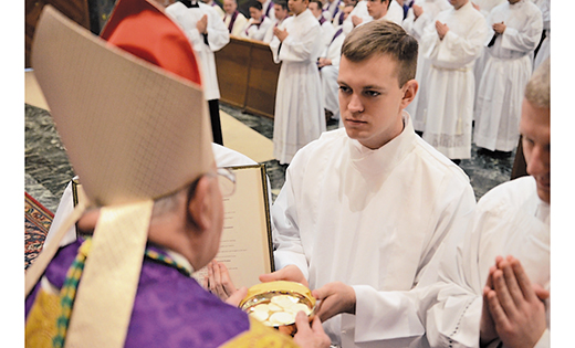 Joshua Nevitt, a seminarian of the Diocese of Camden currently in his second year of theology at the Pontifical North American College, Rome, recently received the ministry of acolyte from Bishop Paul Loverde of Arlington, Va.  He is pictured below with Bishop Loverde and Msgr. James Checchio, a priest of the Camden Diocese who is rector of North American College. Nevitt’s home parish is Our Lady of Peace in Williamstown.