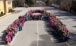 Students of St. Joseph School, Somers Point, form a living autism awareness ribbon on April 1.