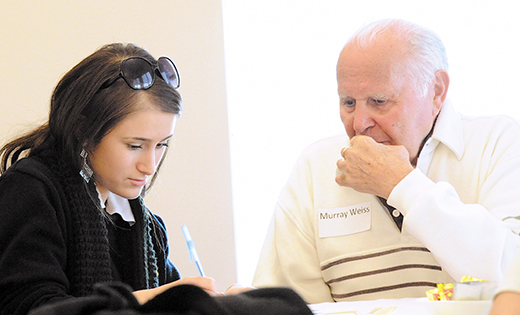 The Sara and Sam Schoffer Holocaust Resource Center and Jewish Family Service of Atlantic and Cape May counties hosted a luncheon for Holocaust survivors at which they met with students of Holy Spirit High School, Absecon. Each survivor was interviewed by a student. Each student participant will receive a certificate of participation to pledge to tell the Holocaust survivors’ stories in the year 2045 – 100 years after liberation. Above, Lauren Salvo takes notes from Murray Weiss. The Holocaust, Genocide and Crimes Against Humanity Course is part of the History Department at Holy Spirit and taught by Linda Mulvihill, who holds a master’s degree in Holocaust and Genocide Studies.

Photo by Alan M. Dumoff