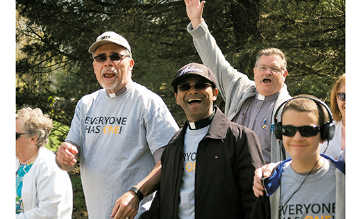 Deacon Gerard Jablonowski, Father Sanjai Devis and Deacon Joseph Kain, all from Church of the Holy Family, Sewell, feel good starting their 1.3-mile walk during the iRace4Vocations, which took place April 26, World Day of Prayer for Vocations, at Washington Lake Park in Sewell. Families came together for Mass with Bishop Dennis Sullivan, followed by a run/walk, picnic, and fun and games.

Photo by James A. McBride