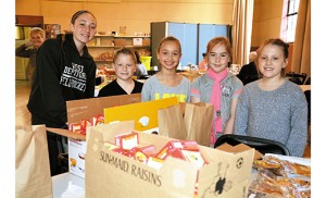 Working in the Cathedral Pantry on Thursday, April 23, Take Our Daughters and Sons to Work Day, are children of Camden Diocesan employees. From left, Mackenzie Jupin, West Deptford Middle School; Patrick Boyle, St. Margaret, Woodbury Heights; Sydney Urbach, Christ the King, Haddonfield; Kayla McGirl, Our Lady of Hope, Blackwood; and Mia Soper, Christ the King, Haddonfield. Photo by Cynthia Soper