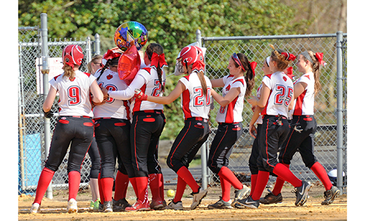 St. Joseph’s beat visiting Wildwood Catholic 13-3 in girls’ softball in Hammonton, on April 16. Above, Wildwood Catholic’s Carly Testa is mobbed by her teammates after breaking the school’s record for lead-off hits, with 156 in her career.

Photo by Alan M. Dumoff, ccdphotolibrary.smugmug.com
