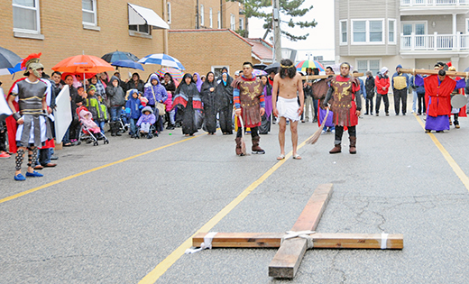Parishioners of St. Damien, Ocean City, enact the Way of the Cross on Good Friday.

Photo by Alan M. Dumoff