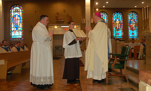 Bishop Dennis Sullivan, assisted by seminarian Matthew Pluta, prays over newly-ordained Deacon Edward Kennedy May 9 at Our Lady of Guadalupe Parish Shrine, St. Lawrence Church, in Lindenwold. The Mass and ordination marked Rev. Mr. Kennedy’s final step before priestly ordination. Pictured in bottom photo are his cousins, Father Raymond Gormley and Msgr. William Hodge.

Photos by James A. McBride