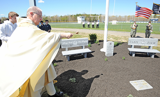 Augustinian Father Donald Reilly, resident of St. Augustine Prep, blesses the Richland school’s new Veterans Memorial, which was unveiled during a ceremony on April 29. The memorial honors two school alumni: 1st Lieutenant Salvatore S. Corma II, Class of 2004 and graduate of the 2008 United States Military Academy class, who died at the age of 24 in 2010, while jumping on an improvised explosive device in Afghanistan to save his men; and PFC Edward K. Miller, a 1966 graduate of St. Augustine, who died in 1968, while serving in the Vietnam War.

Photo by Alan M. Dumoff, ccdphotolibrary.smugmug.com