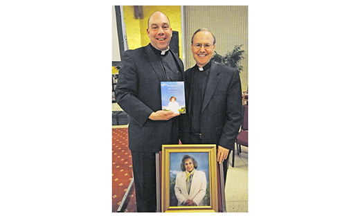 On April 27, Father Timothy Byerley and Father Cadmus Mazzarella spoke at St. Joseph High School, Hammonton, on Servant of God Maria Esperanza and the messages of Mary, Virgin and Mother, Reconciler of all Peoples and Nations in Betania, Venezuela, where Esperanza was the chief visionary. Left, Father Christopher Markellos, Director of Catholic Identity at St. Joseph, and Father Byerley, Vice-Postulator for the Beatification and Canonization Cause of Maria Esperanza, with Father Byerley’s book on Esperanza.

Photo by Alan M. Dumoff