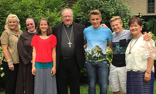 On June 19, the iRace4Vocations committee had lunch at Bishop Dennis Sullivan’s residence in Woodbury with the winners of the Prayer Pledge Faithraiser. Pictured are, from left, Mary Hardy, Sister Dianna Higgins, FMIJ, Makenzie Brooks, Bishop Sullivan, Robert Petrie, Ryan Petrie and Helen Fabello.

Photo by John Kalitz