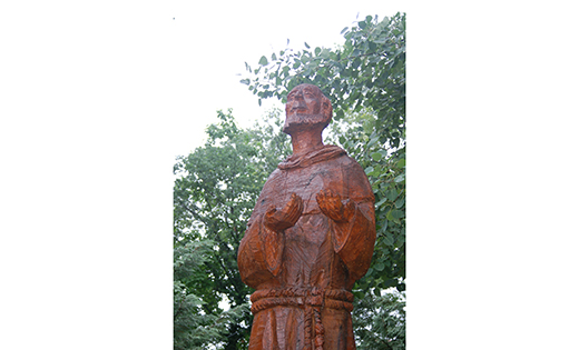 A statue of St. Francis of Assisi is seen in the meditation garden adjacent to The Little Portion of Lourdes Wellness Center in Collingswood. “Laudato Si’,” the title Pope Francis chose for his encyclical on the environment, comes from a hymn of praise by St. Francis of Assisi that emphasizes being in harmony with God, with other creatures and with other human beings, said the head of the Franciscan order.

Photo by James A. McBride