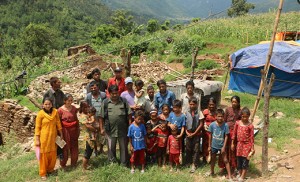Catholic families stand in front of their home on Kyaltung Mountain in Sindhupalchowk, Nepal, July 12. Bishop Dennis Sullivan authorized a special collection in May after the country suffered a magnitude-7.8 earthquake. The collection raised $145,597.90 for victims. CNS photo/Anto Akkara