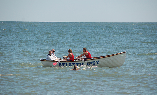 Bishop Dennis Sullivan is taken into the surf in an Atlantic City lifeboat during last year’s Wedding of the Sea. This year’s ceremony is scheduled for Aug. 15.

Photo by James A. McBride