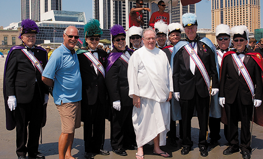 Bishop Dennis Sullivan and Atlantic City Mayor Don Guardian pose for a photo with Fourth Degree Knights of Columbus during the Wedding of the Sea ceremony in Atlantic City on Aug. 15, the feast of the Assumption.

Photo by James A. McBride