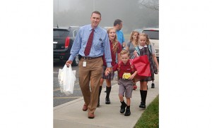 Students arrive at St. John Paul II School, Stratford. Photo by James A. McBride