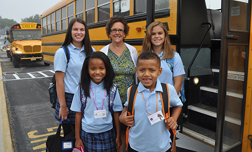 St. Mary School, Williamstown principal Patricia Mancuso welcomes students. The students are (back, from left) eighth graders Gabriella Cusano and Alexis Duganitz, and (front, left) third grader Willow Massenberg and (front, right) first grader Logan Massenberg.

Photo by Jackie Kern