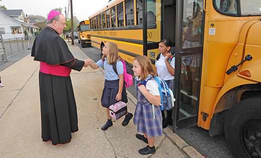 The 2015-16 school year began before Labor Day this year at Catholic schools in the Camden Diocese with students arriving for classes on Wednesday, Sept. 2. Bishop Dennis Sullivan welcomes students as they get off the bus at Bishop Schad Regional School, Vineland.

Photo by Alan M. Dumoff, ccdphotolibrary.smugmug.com